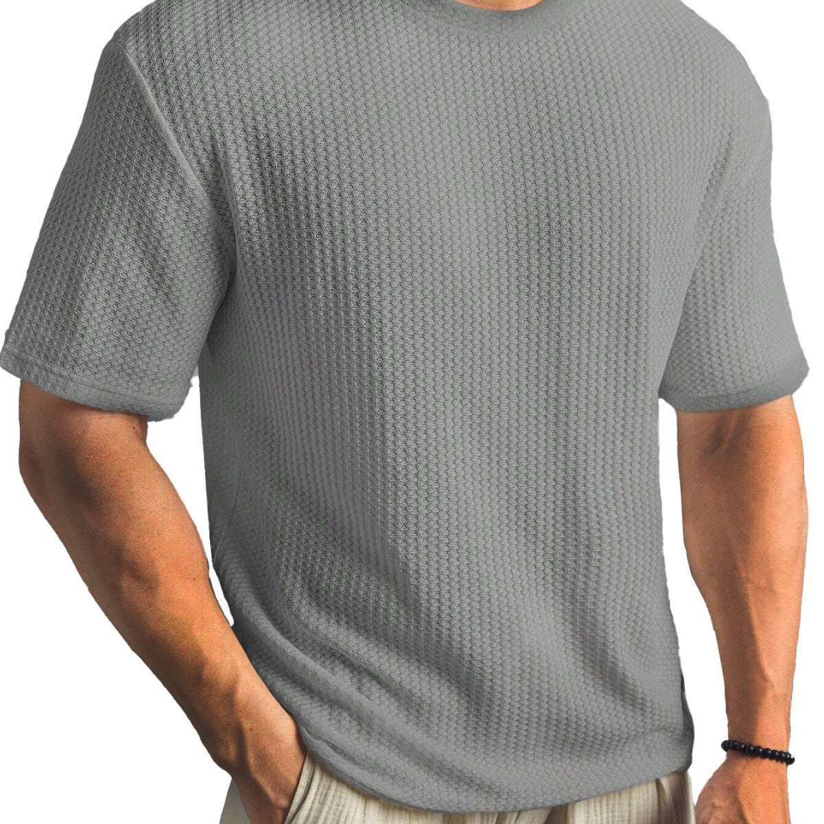 Person wearing a textured gray t-shirt on a white background