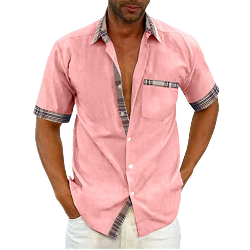 Man wearing a pink short-sleeve shirt with plaid accents on a white background