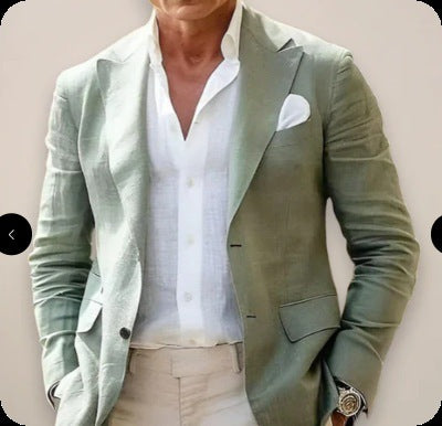 Light green blazer over a white shirt with beige pants on a plain background
