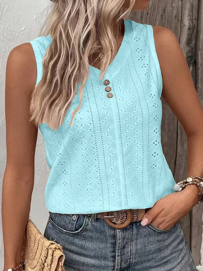 Light blue sleeveless top with button details worn by a person against a neutral background