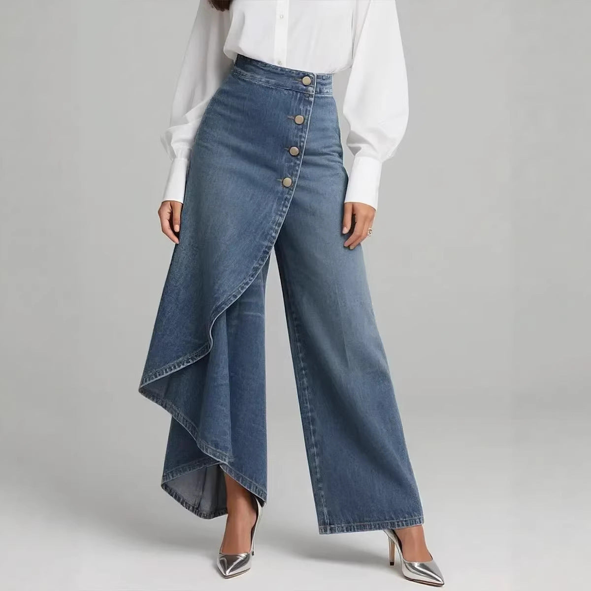 Blue denim wide-leg pants with a white shirt on a gray background