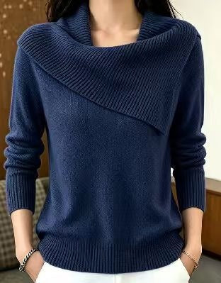 A navy blue knit sweater with a wide draped cowl neckline, worn by a model in an indoor setting.