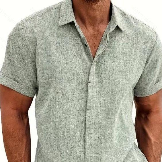 Man wearing a light green short-sleeve shirt on a white background