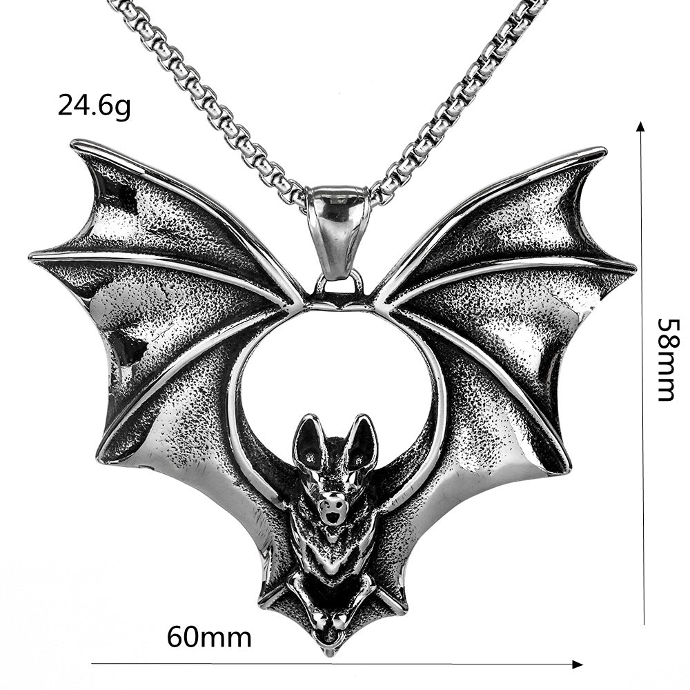 Silver bat pendant necklace with measurements on a white background
