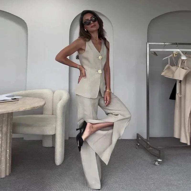 Chic woman in beige tailored vest and wide-leg pants at ZA-Zola, modern fashion showroom