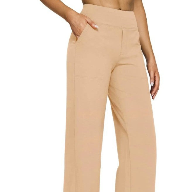 Beige high-waisted pants worn by a person on a white background
