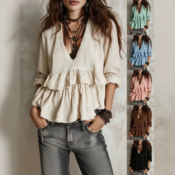 A woman models a bohemian-style cream ruffled blouse with a V-neck and layered ruffles, paired with gray jeans and layered necklaces. A vertical strip on the right shows the blouse in multiple colors (green, blue, pink, brown, black).