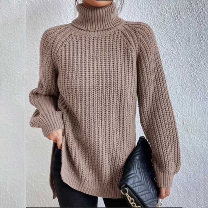 Person wearing a brown knitted sweater against a light background