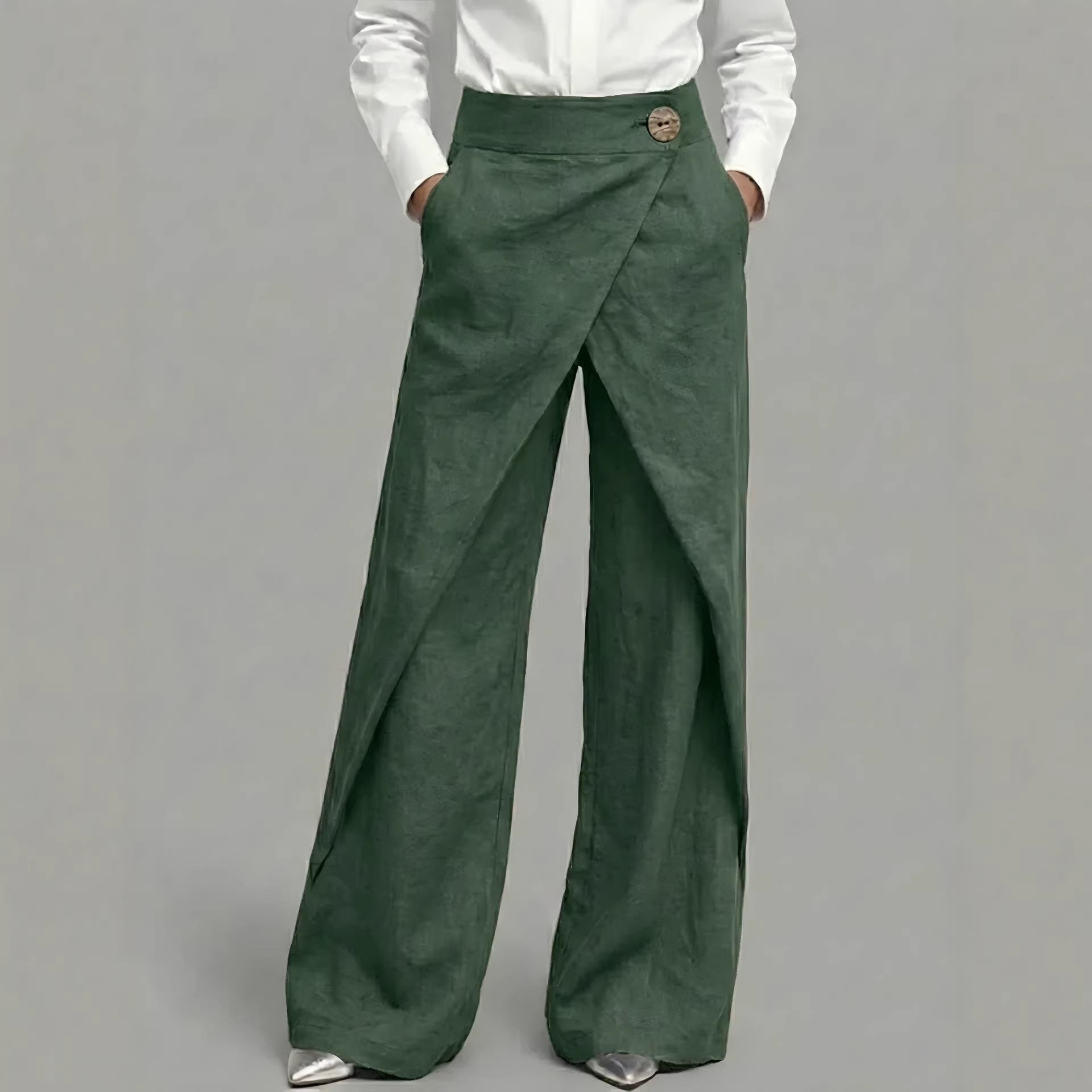 Green wide-leg pants worn by a person on a gray background