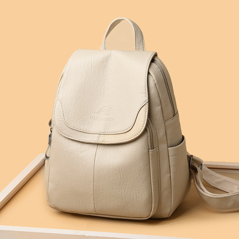 Beige backpack on a beige background