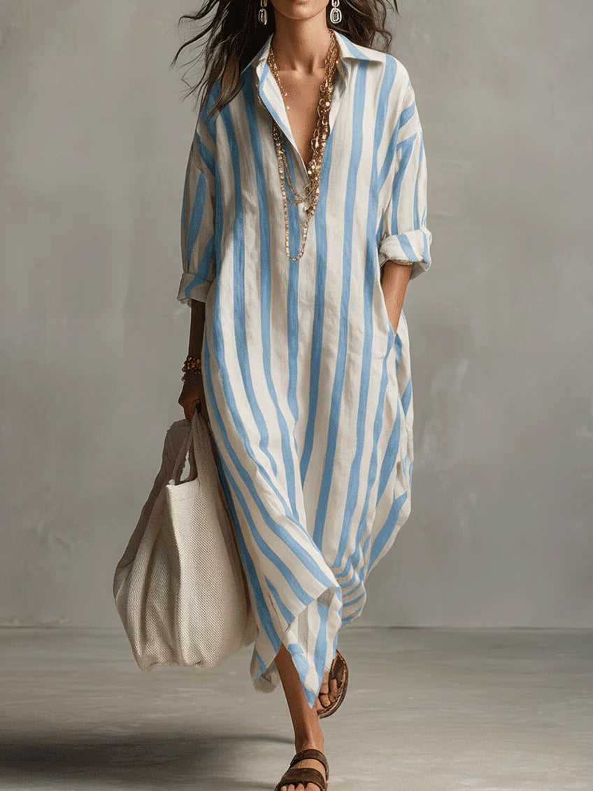 Woman wearing a blue and white striped dress with a plain background