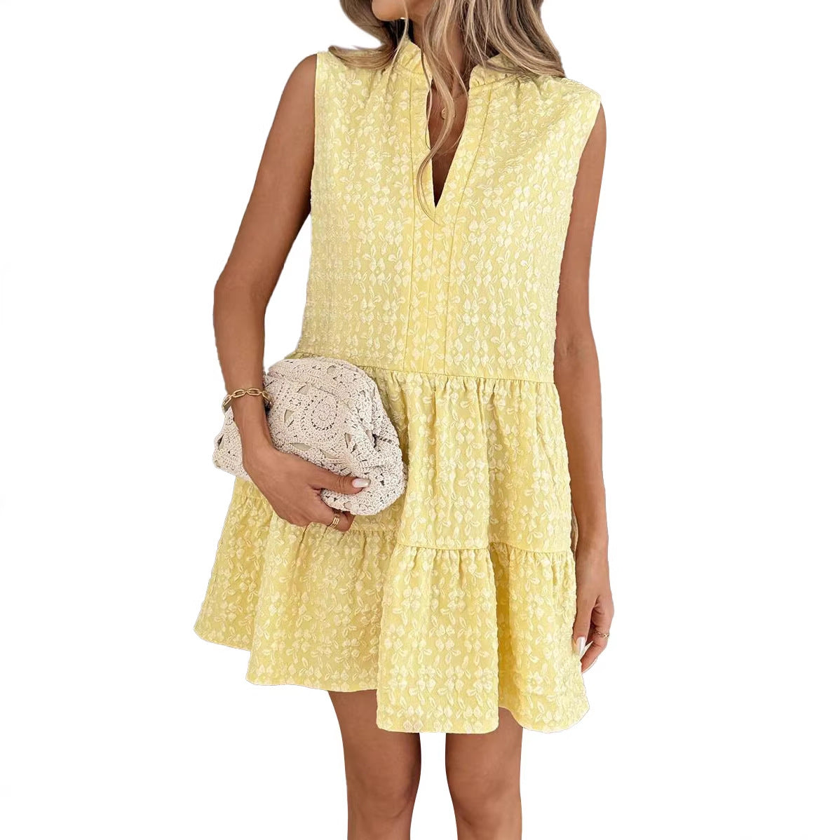 Woman wearing a yellow dress with a white background