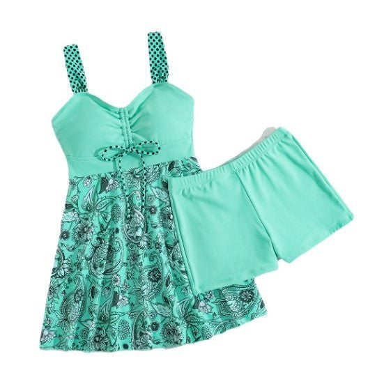 Mint green dress with floral pattern and matching shorts on a white background