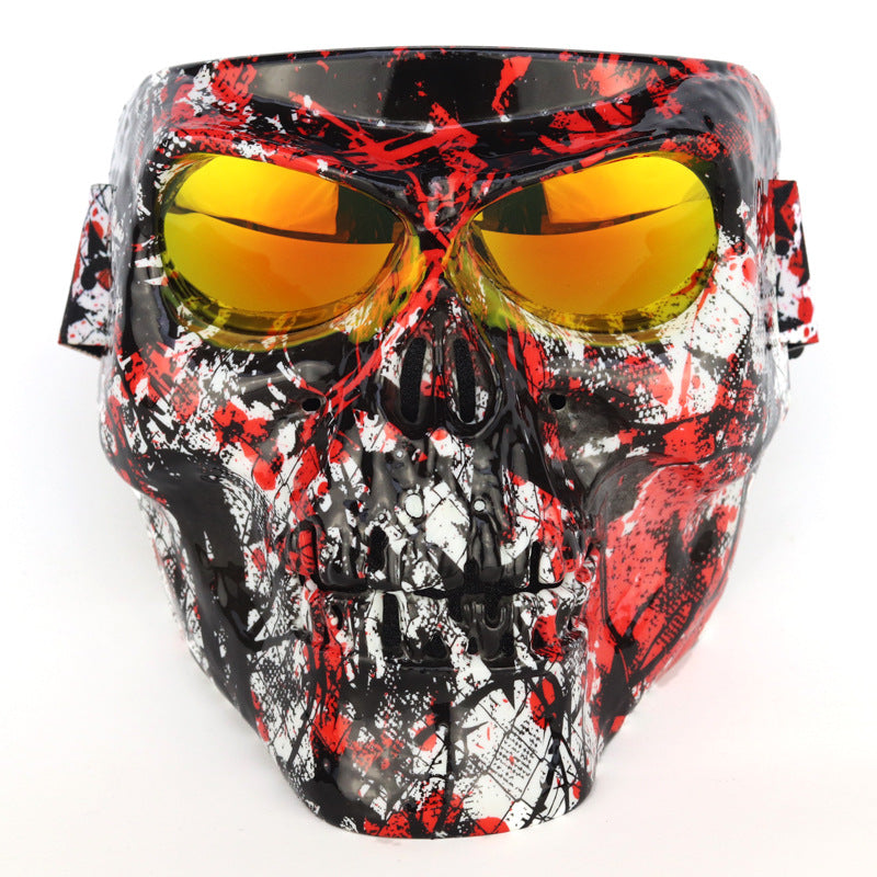 Skull-themed goggles with red and black design on a white background