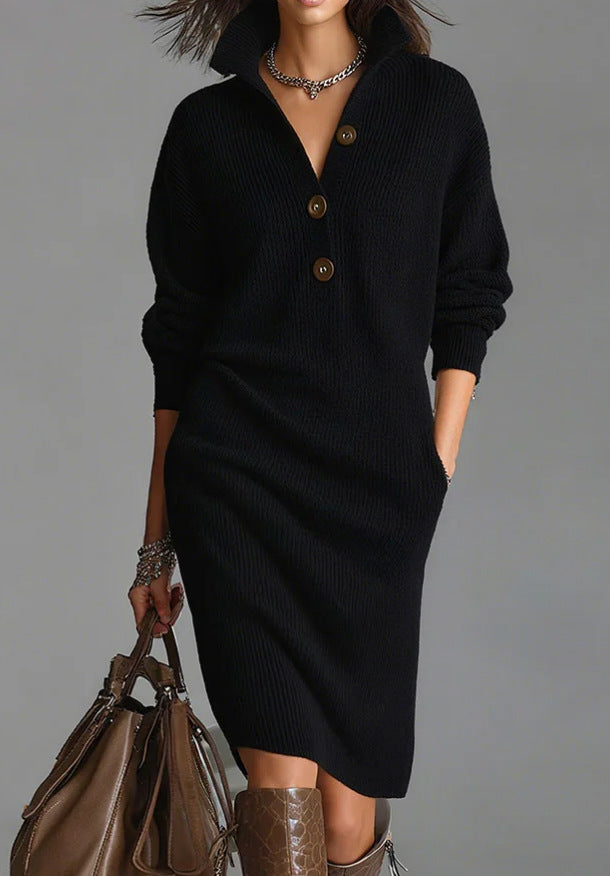 Woman wearing a black dress with buttons, holding a brown handbag against a gray background