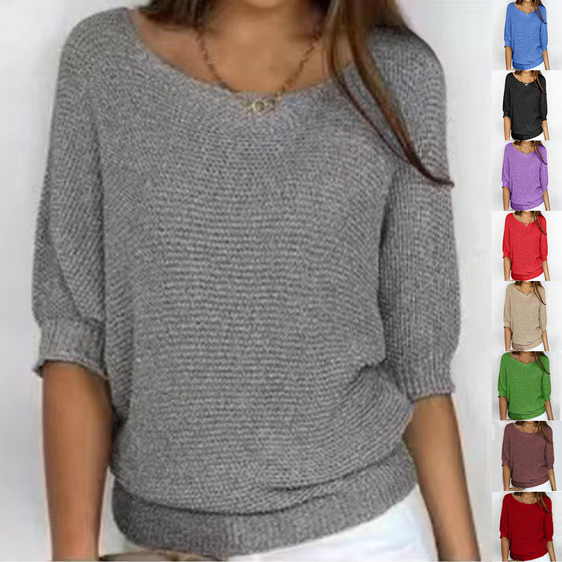 A woman wearing a gray knit sweater with a wide boat neckline and elbow-length sleeves, shown against a plain light background. A vertical strip on the right shows the same sweater in multiple color options: blue, black, purple, red, pink, beige, green, brown, and red.