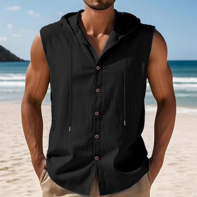Man wearing a black sleeveless shirt on a beach