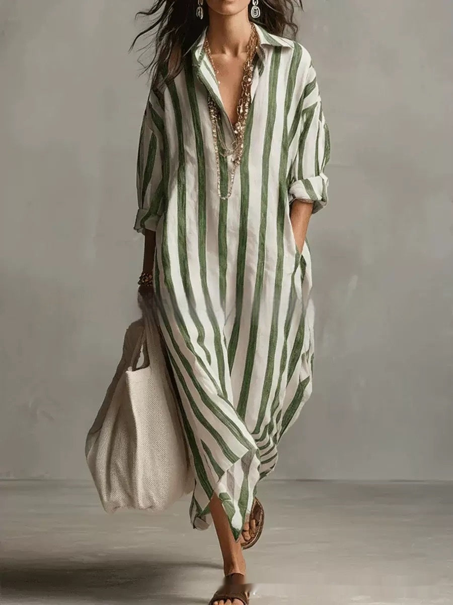 Woman wearing a green and white striped dress against a neutral background