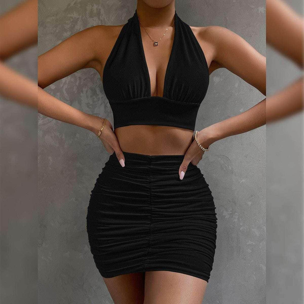 Woman modeling trendy black halter crop top and ruched mini skirt, ZA-Zola fashion UK