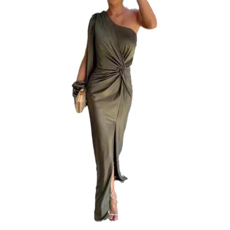 Woman wearing a green one-shoulder dress on a white background