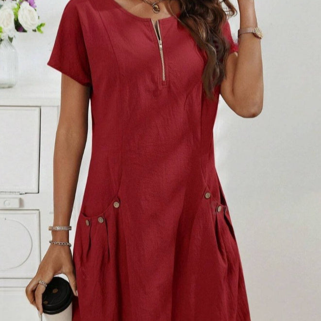Red dress worn by a person with a white background