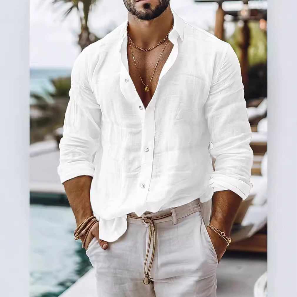 Man wearing a white shirt and beige pants with a blurred background