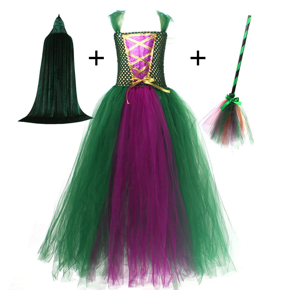 Halloween costume set with dress, cape, and broom on a white background