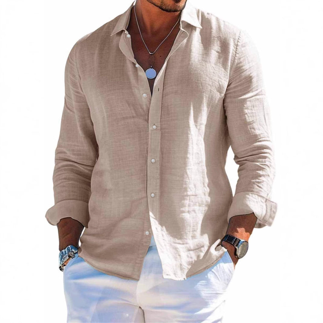 Man wearing a beige button-up shirt and white pants on a white background