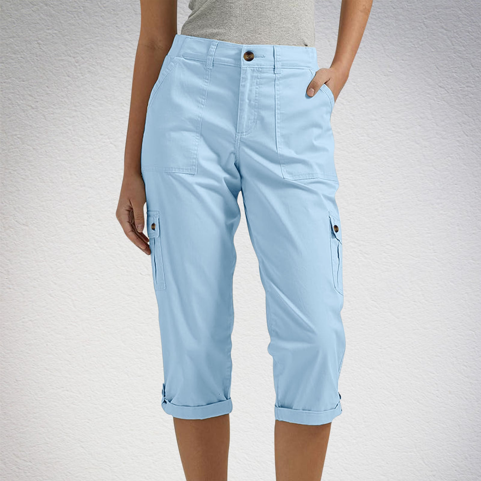 Light blue cargo pants worn by a person on a light gray background