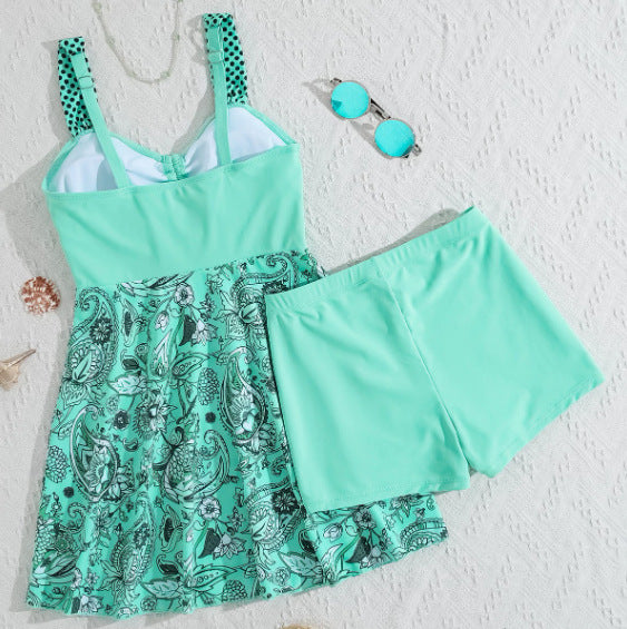 Mint green swimsuit with paisley pattern on a white background