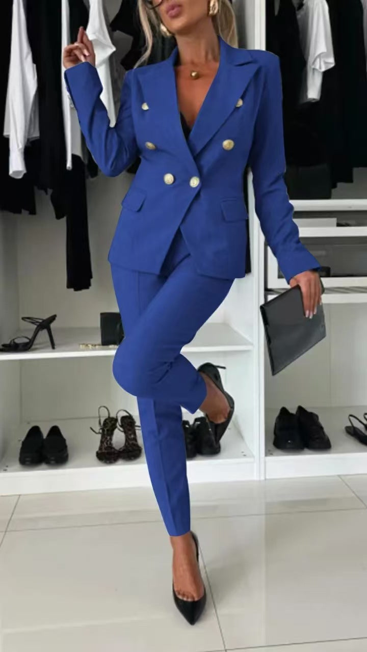 Person wearing a blue suit with gold buttons in a clothing store.