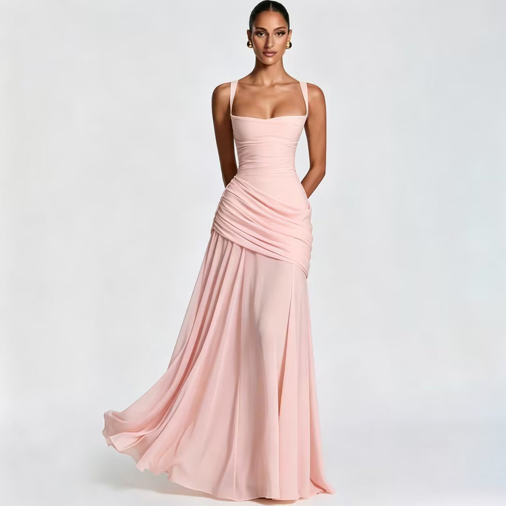 Woman wearing a pink evening gown on a light gray background