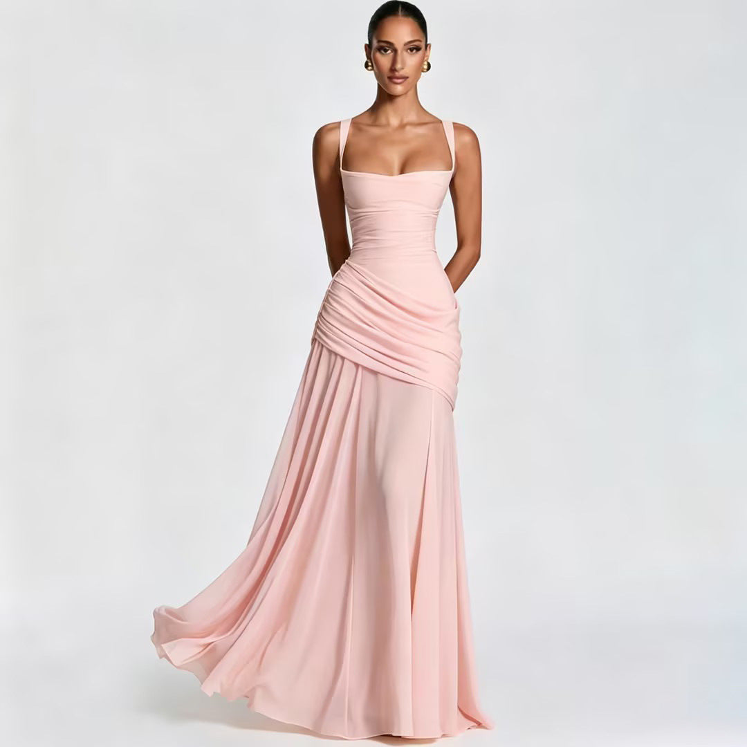 Woman wearing a pink evening gown on a light gray background