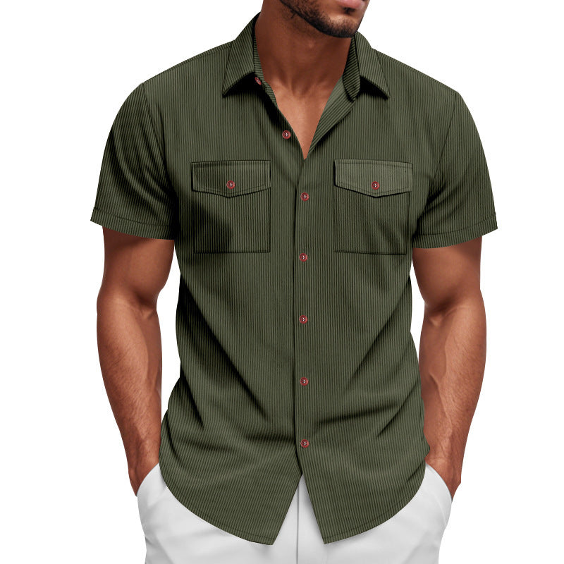 Green short-sleeve shirt with red buttons worn by a person on a white background