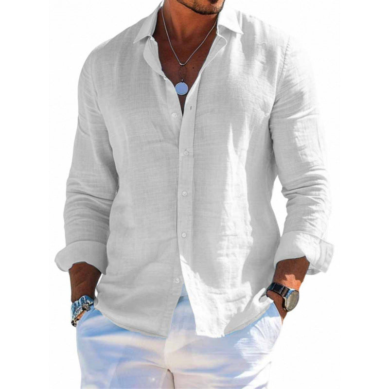 Man wearing a white button-up shirt and light blue pants on a white background