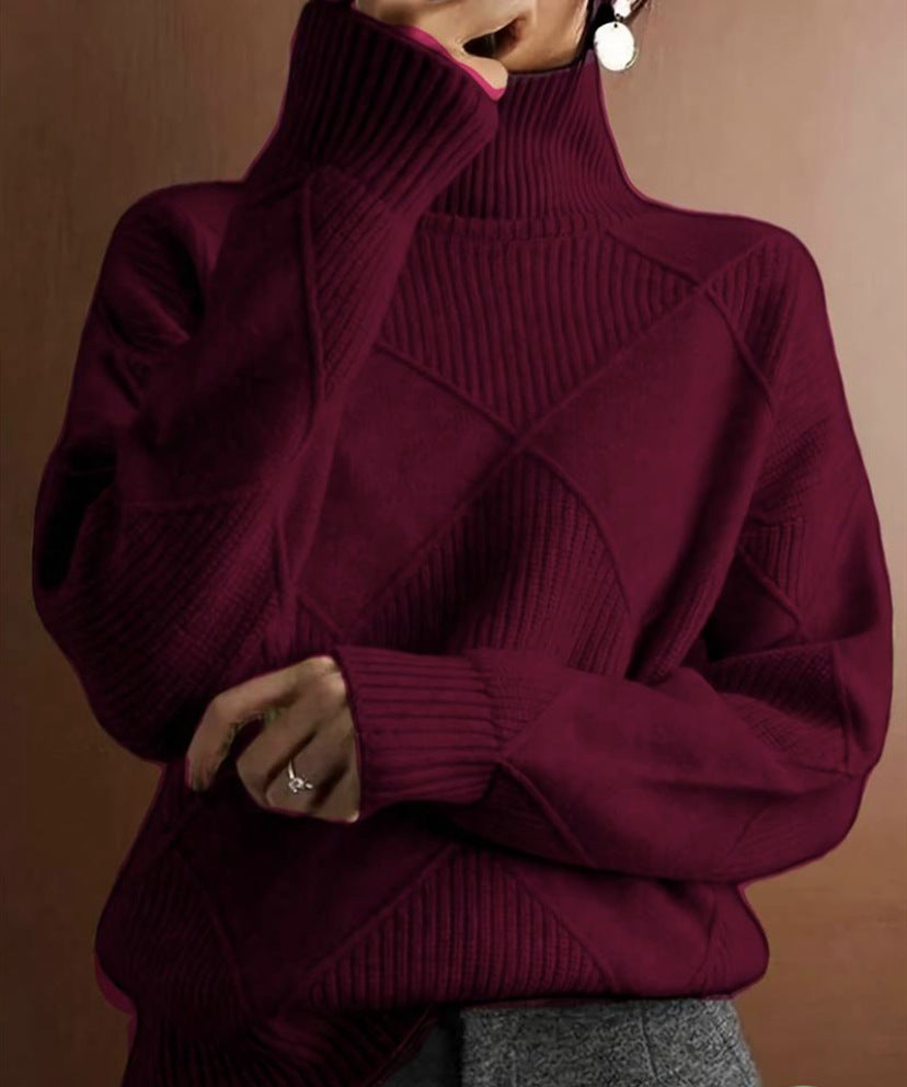 Maroon turtleneck sweater worn by a person on a brown background
