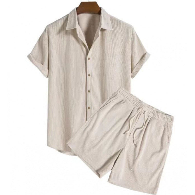 Beige pajama set with shirt and shorts on a white background