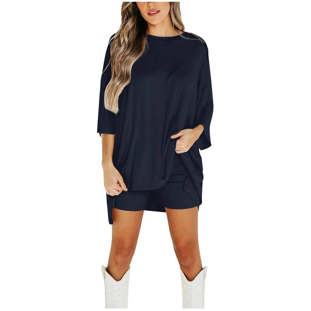 Woman wearing black oversized top and shorts set with white boots, ZA-Zola fashion