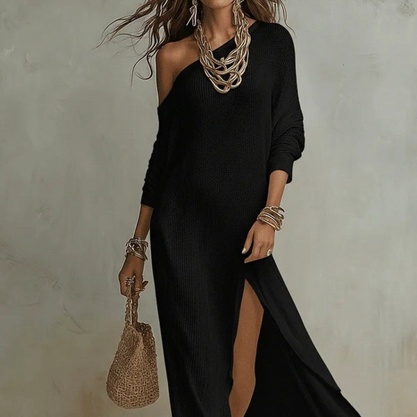 Woman wearing a black off-shoulder dress with a textured handbag against a neutral background