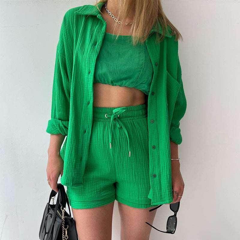 Woman modeling bright green three-piece summer set with shirt, crop top, and shorts from ZA-Zola