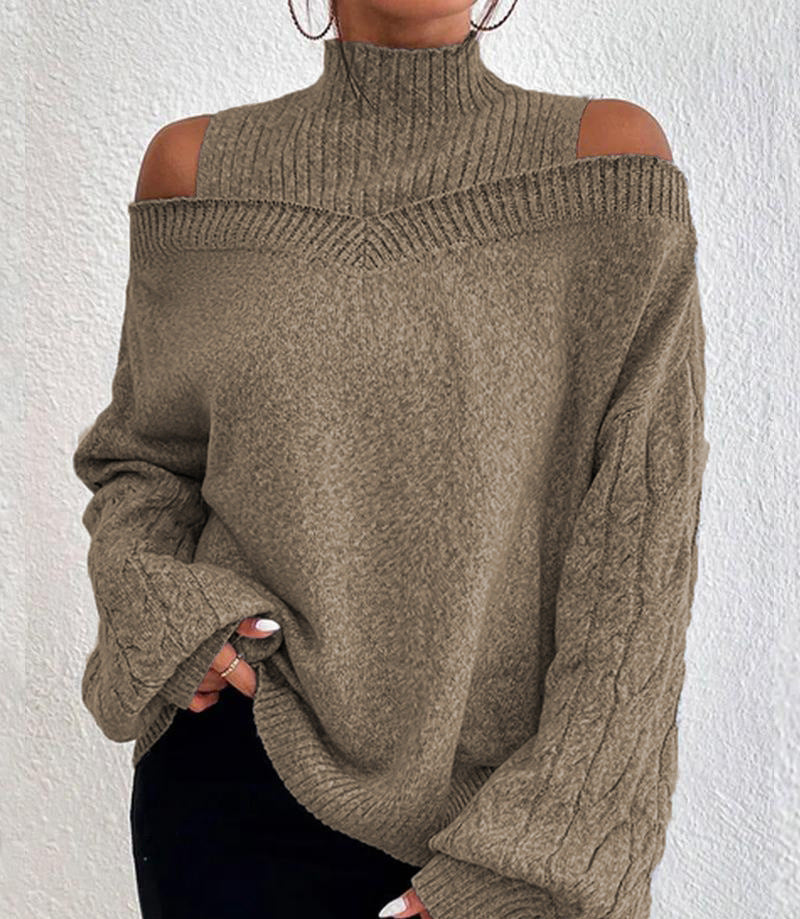 Brown knitted sweater with cut-out shoulders on a white background