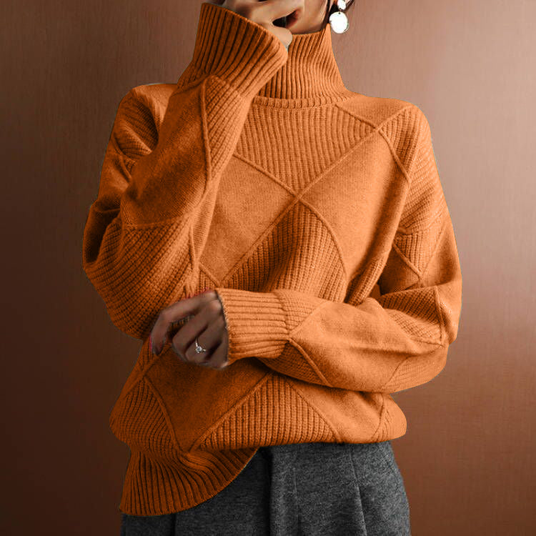 Person wearing a brown turtleneck sweater against a brown background