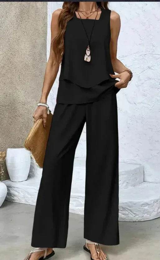 Woman wearing a chic black sleeveless top and wide-leg pants set, trendy ZA-Zola UK fashion
