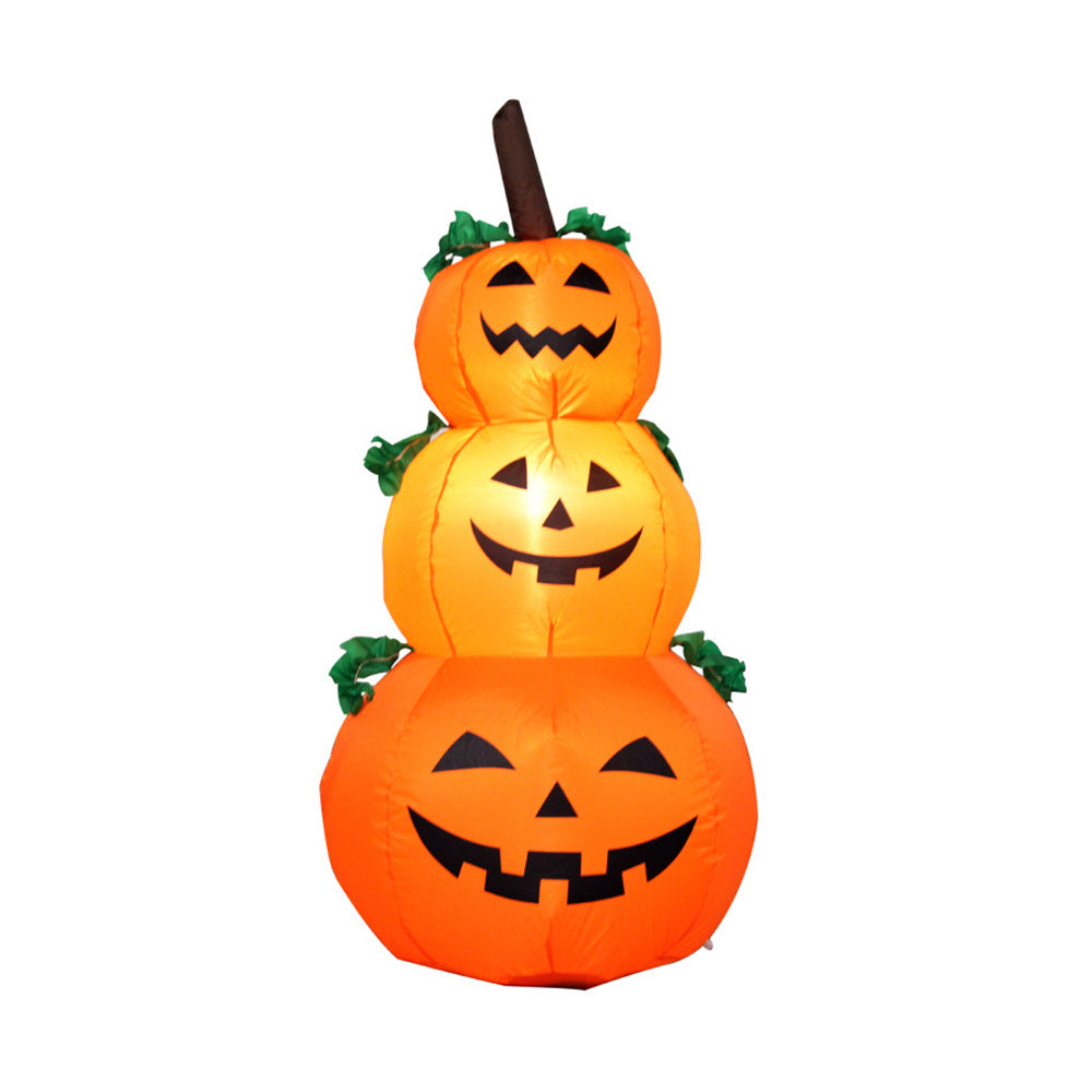 Stack of three inflatable pumpkins with jack-o'-lantern faces on a white background
