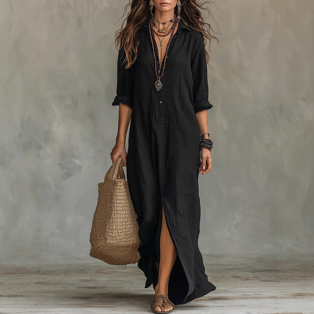 Woman wearing a black dress holding a woven bag against a neutral background